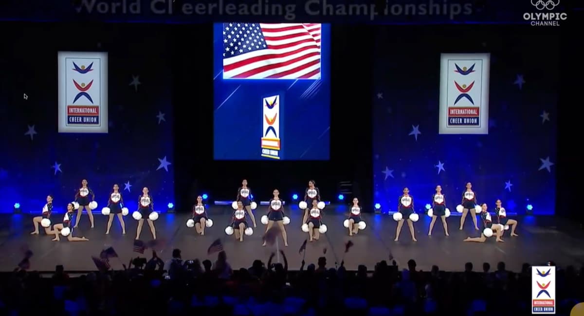 Los Alamitos D1 Varsity Song Team performing at 2026 ICU World Championships semi-finals — broadcast on the Olympic Channel